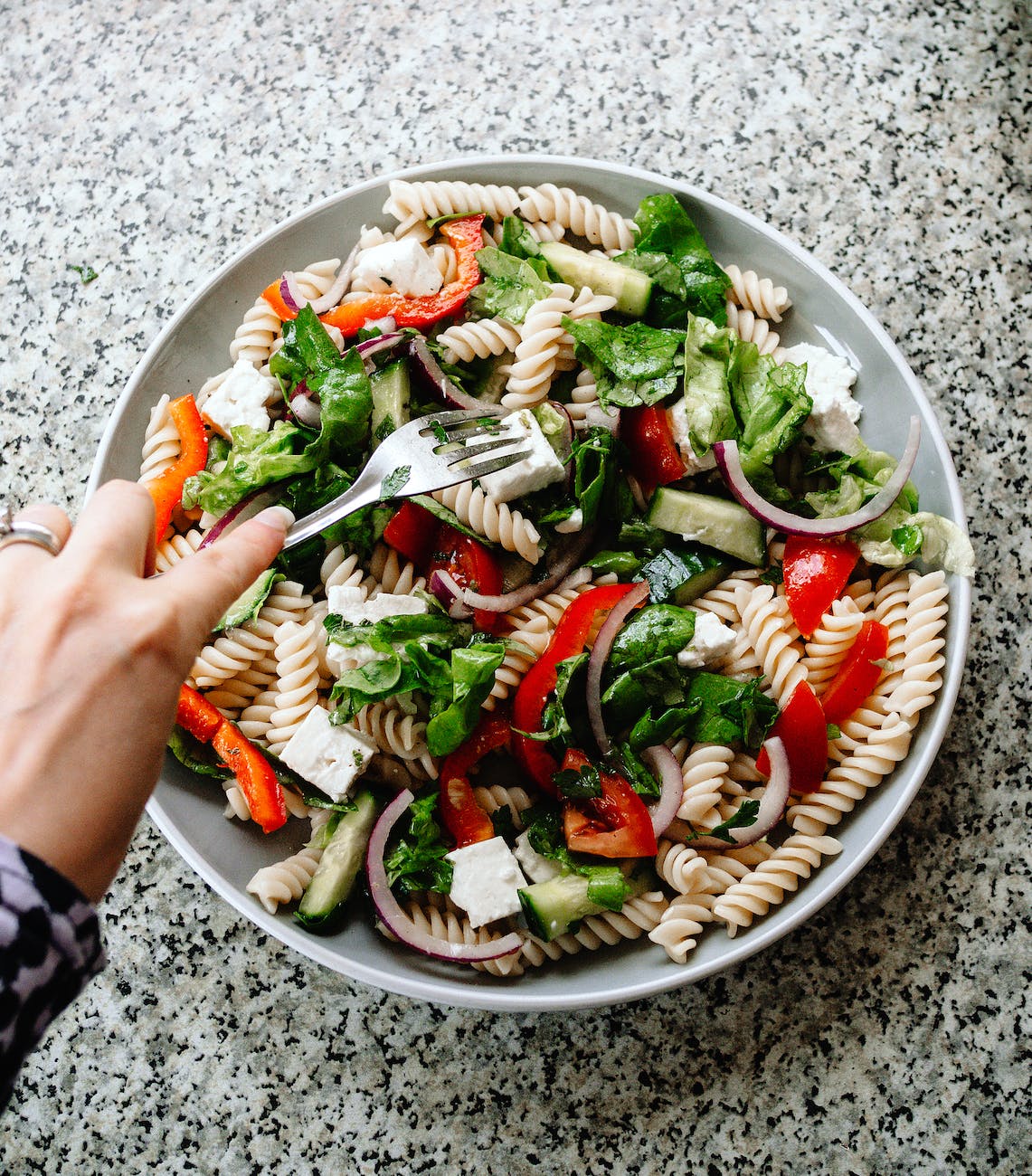 a vegetable salad on a ceramic bowl