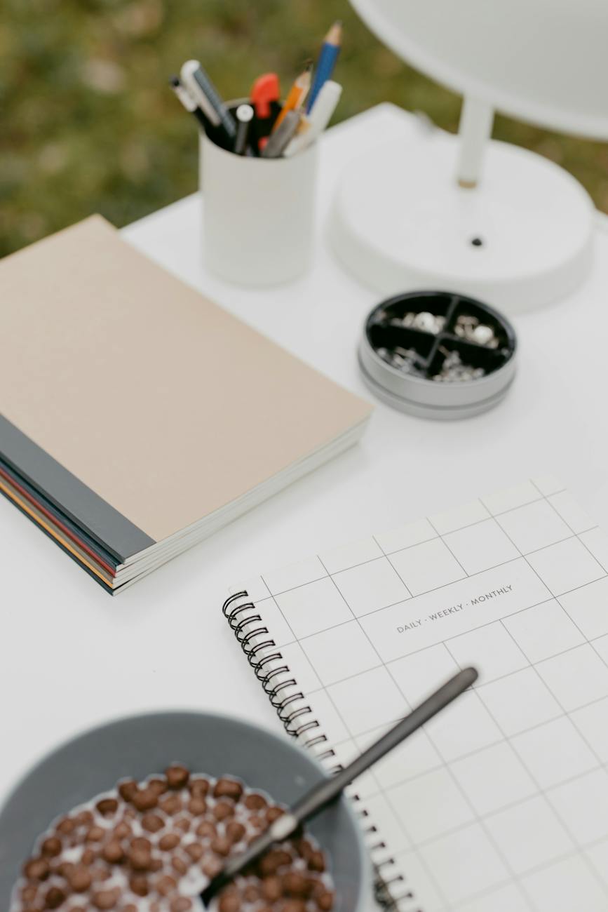 notebook and cereal on a table