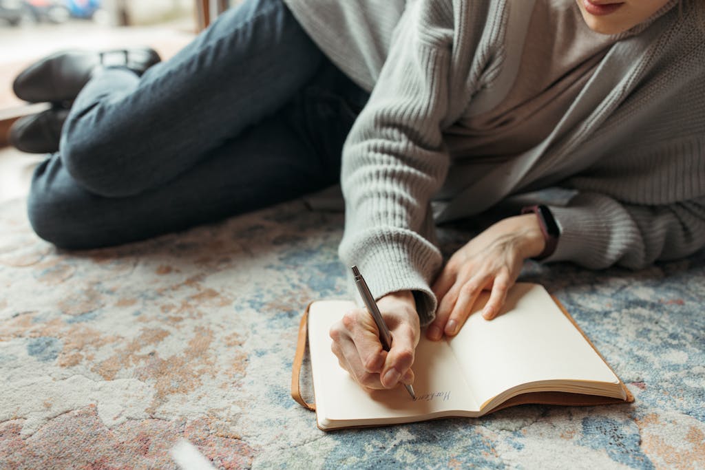 Close-Up Shot of Person Writing a Diary