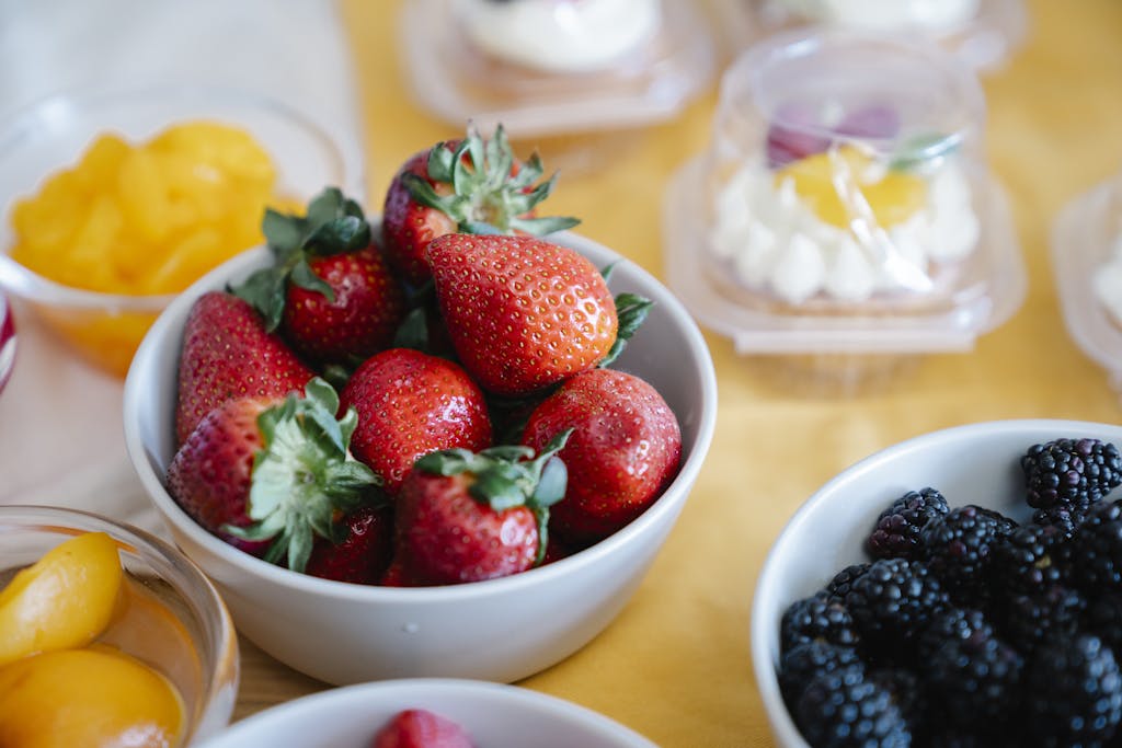 Strawberries and Blueberries on Ceramic Bowls