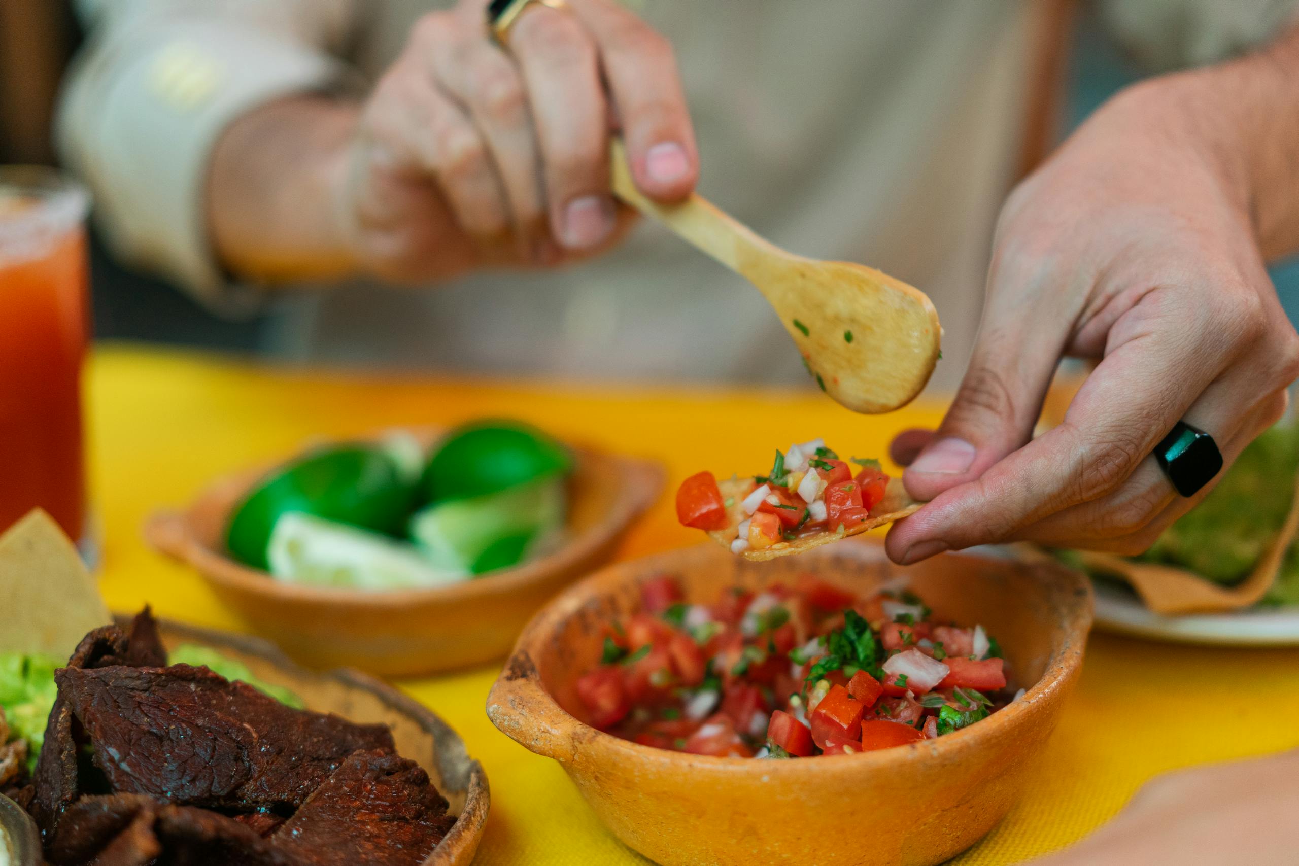 Person Holding Brown Wooden Spoon